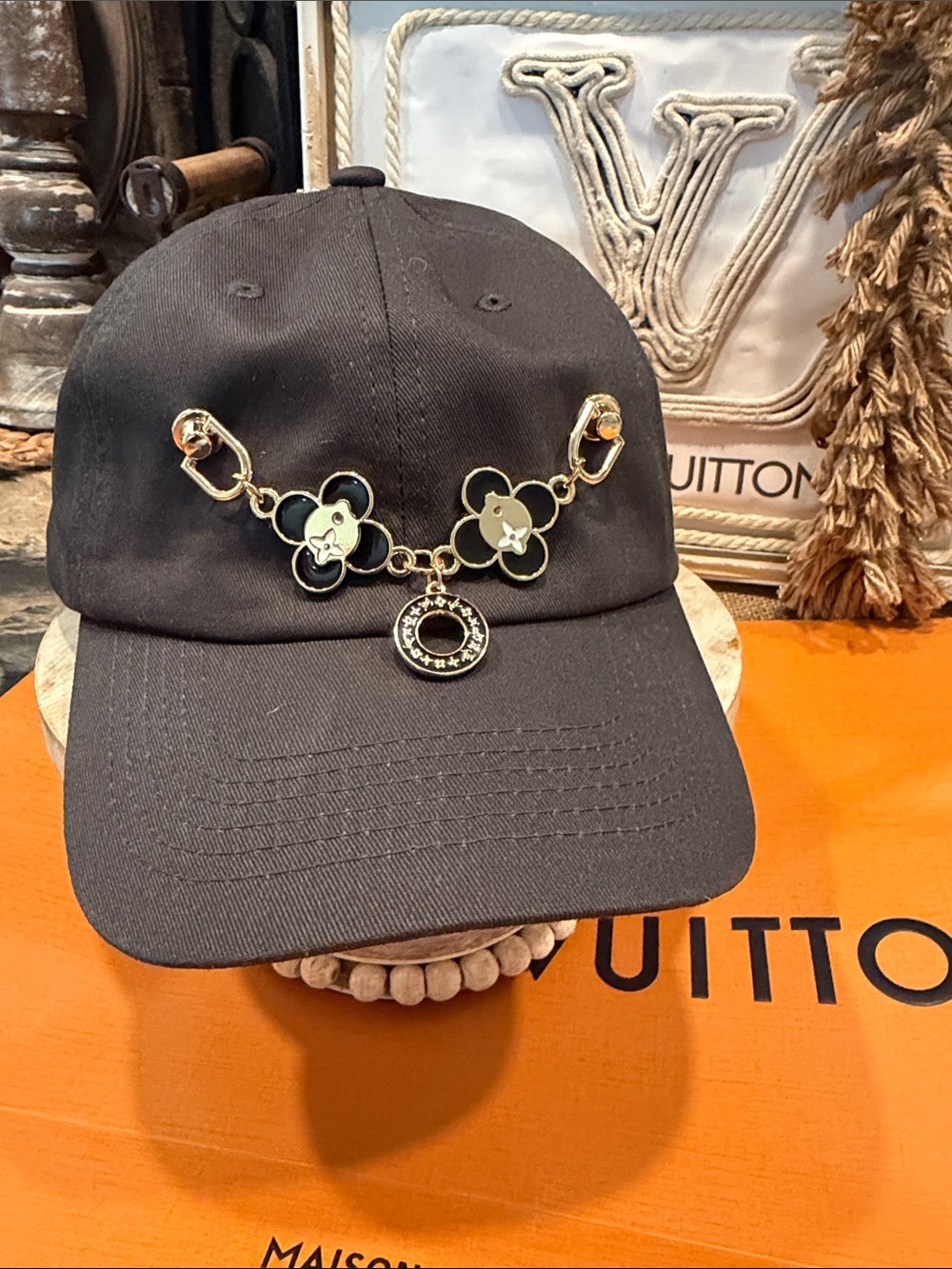Handcrafted Black Cap with Gold Floral Chain Detail and charm